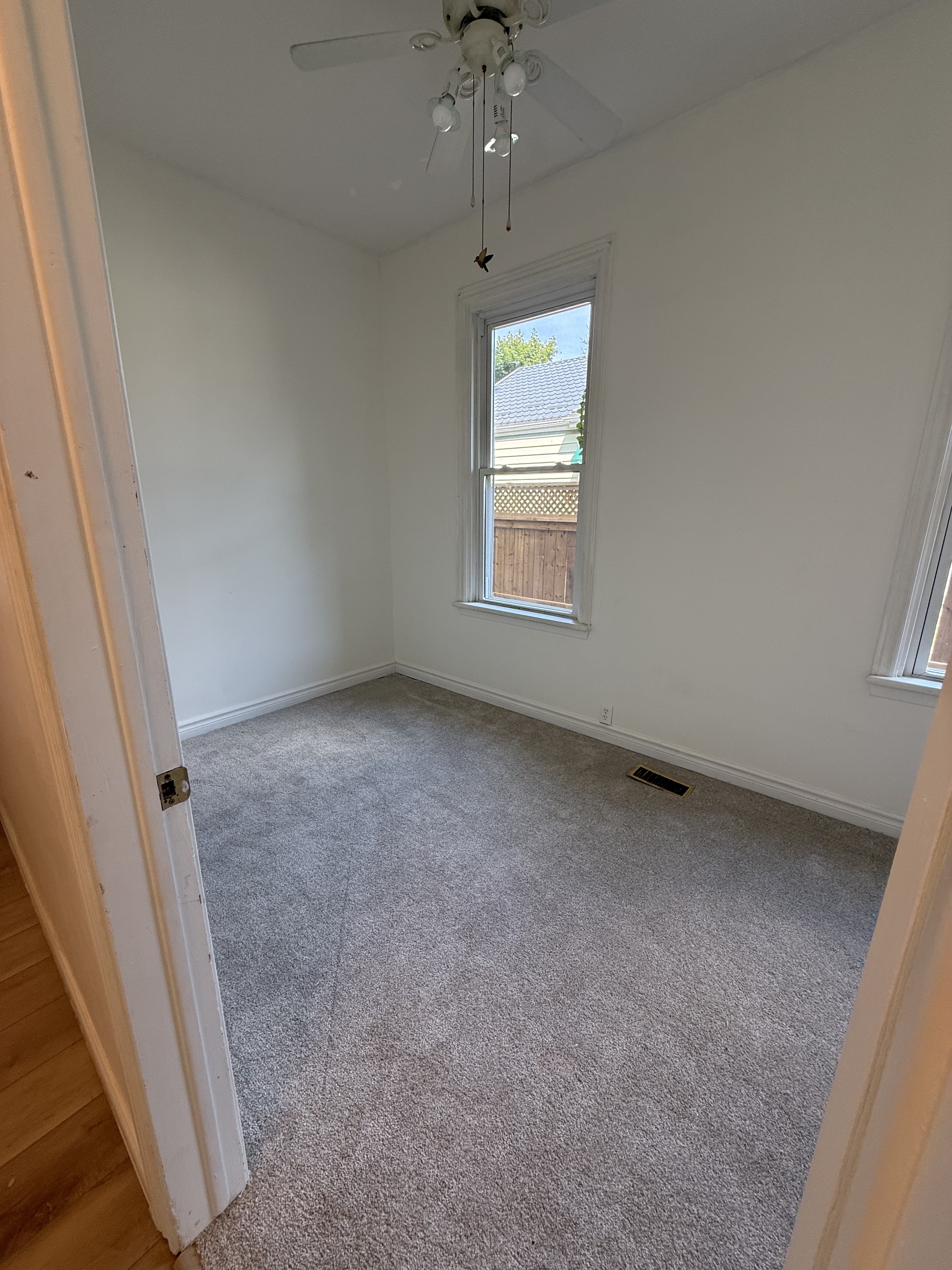 Bright bedroom in main floor London Ontario rental apartment - Wortley Village